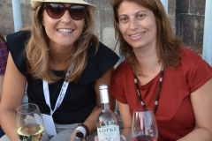 Tania Oliveira and a friend hanging out with a couple of Ports.