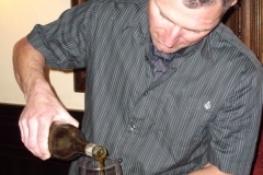 Andy Velebil pouring an 1875 Cucamonga vintage port from CA