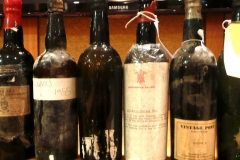An old line up of fine bottles of Port & Madeira