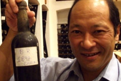 Eric Ifune displays a rare bottle of 1897 VP