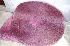 Woven straw pads used for filtering during pressing of the grapes