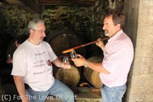 Roy Hersh accepts a barrel sample from Mario Fernandez